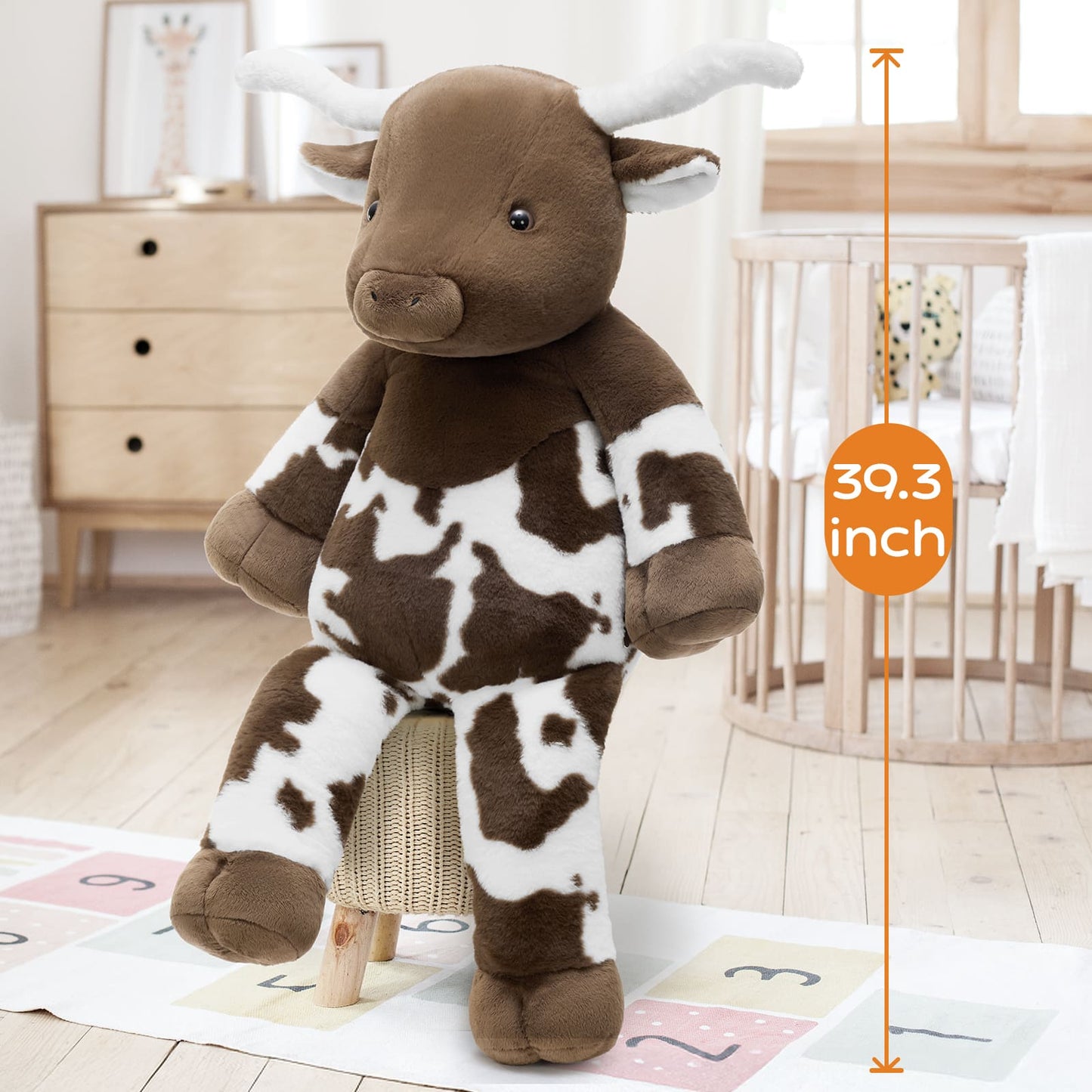 Ultra-soft 39-inch Highland cow stuffed animal with fluffy horns and plush fabric, giant cow plush toy ideal for nursery decoration, gifts, and bedtime cuddles.
