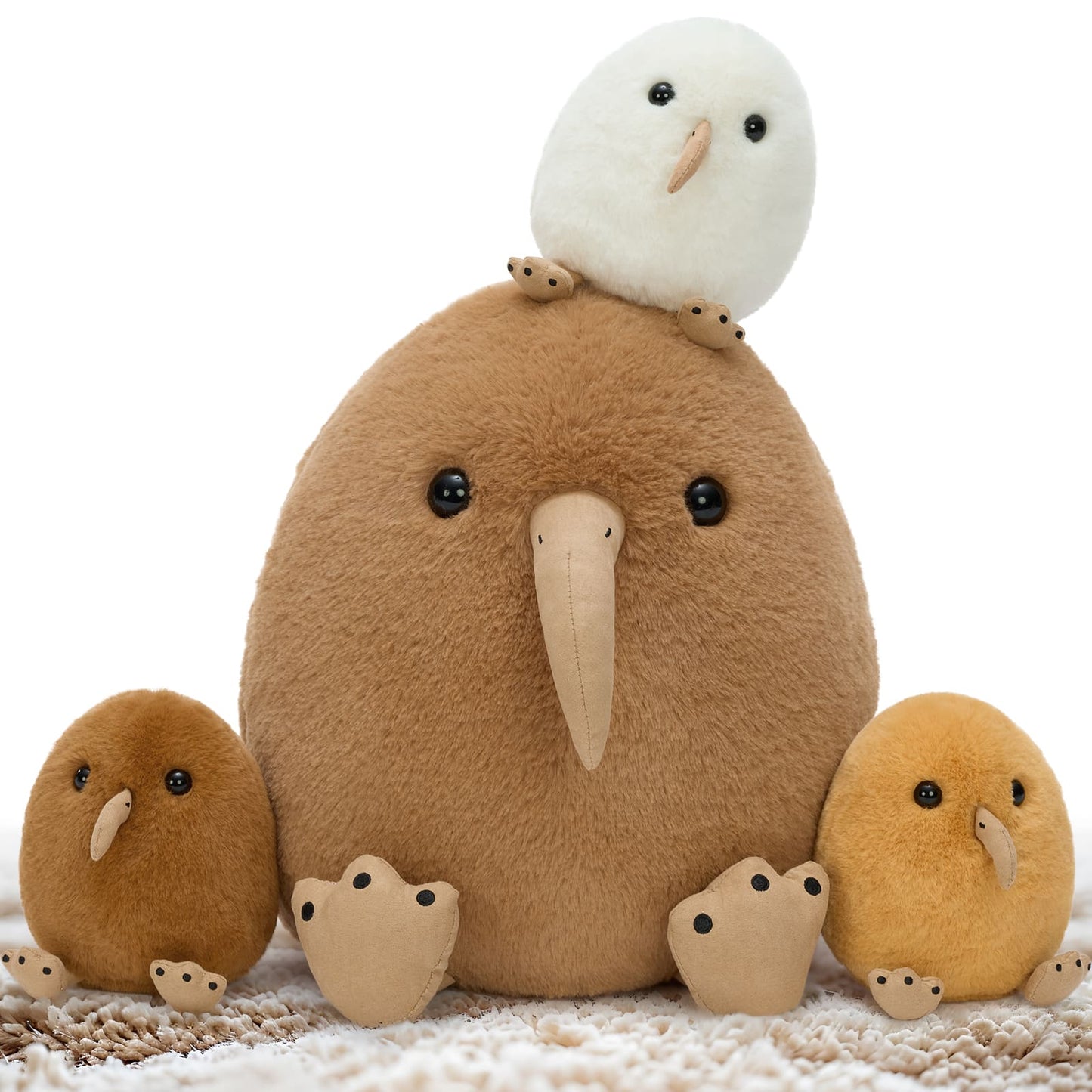 Plush kiwi toy with three smaller kiwi plushies on a white background