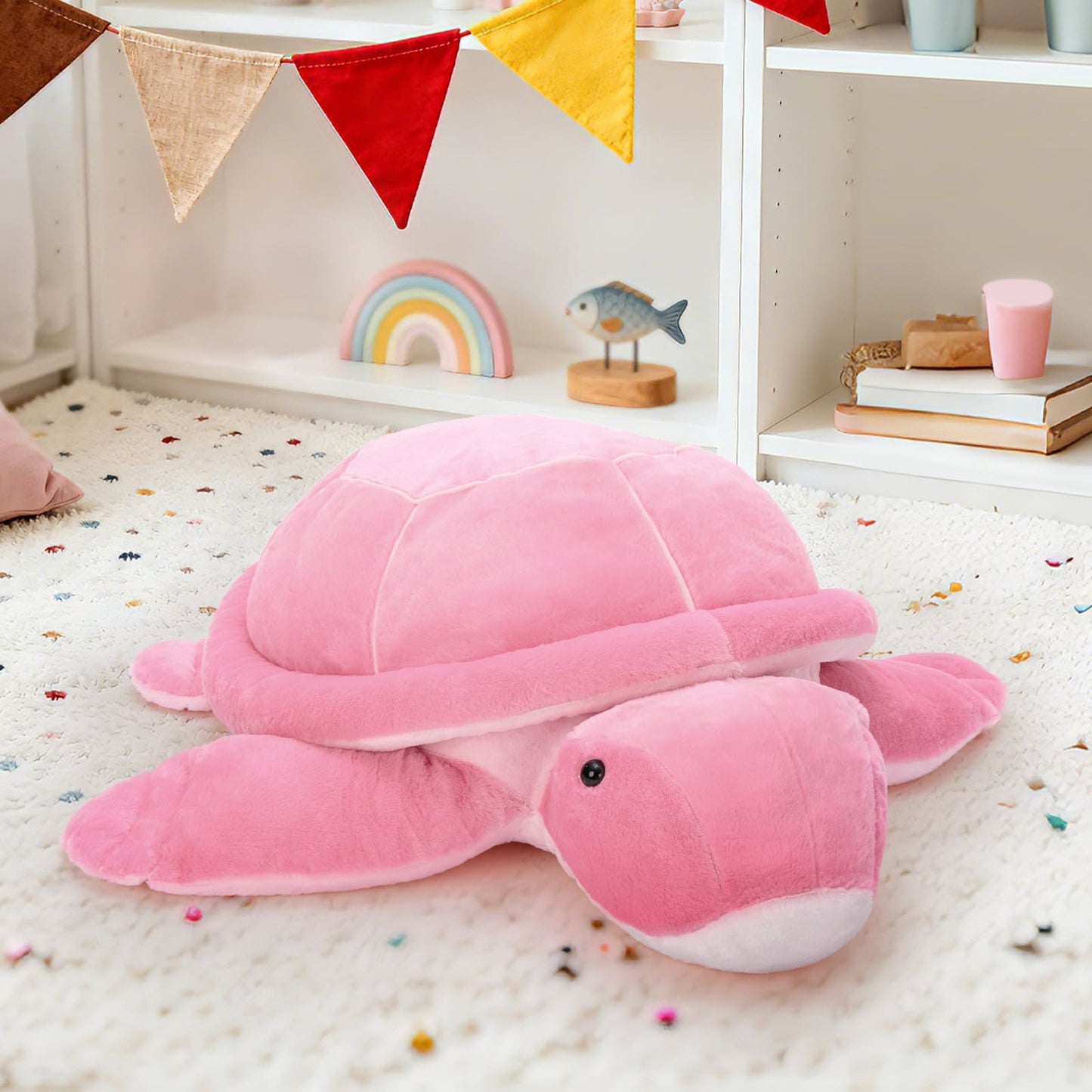 Soft pink turtle plush toy with a rounded shell and flipper legs, cute stuffed animal pillow for cuddling, kids’ room décor, and comfort.